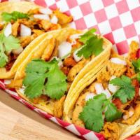 Street Tacos · 3 corn tortillas filled with soy based Carnitas,
salsa picante, chopped onion and cilantro