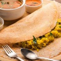 Masala Dosa (V) · Dosa served with potato curry, lentil soup, and coconut and tomato chutney.