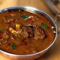 Poori Lamb Curry · Tender lamb curry served with puffed bread