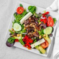 Santorini Lamb Or Chicken Salad · Romaine lettuce, mixed greens, tomatoes, cucumbers, artichoke hearts, roasted red peppers, g...