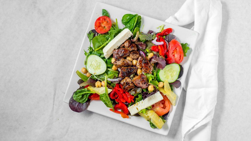 Santorini Lamb Or Chicken Salad · Romaine lettuce, mixed greens, tomatoes, cucumbers, artichoke hearts, roasted red peppers, garbanzo beans, red onions, and feta cheese. Topped with grilled lamb.