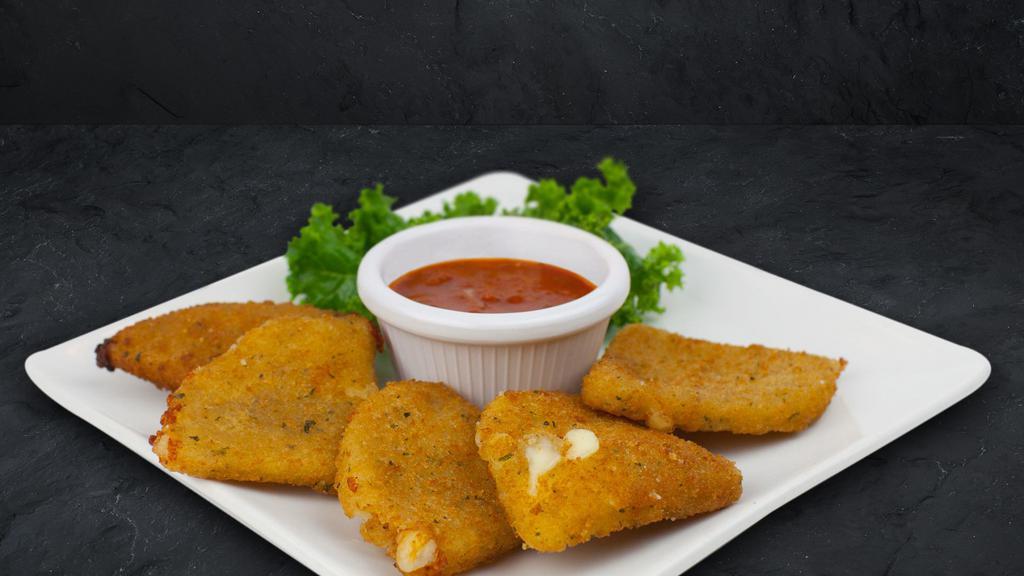 Mozzarella Wedges · Crispy seasoned breading on the outside with warm, melted mozzarella on the inside. Served with marinara sauce.