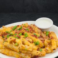 Cheese Fries · Our seasoned fries topped with cheese, bacon pieces, and green onion. Served with ranch sauce.