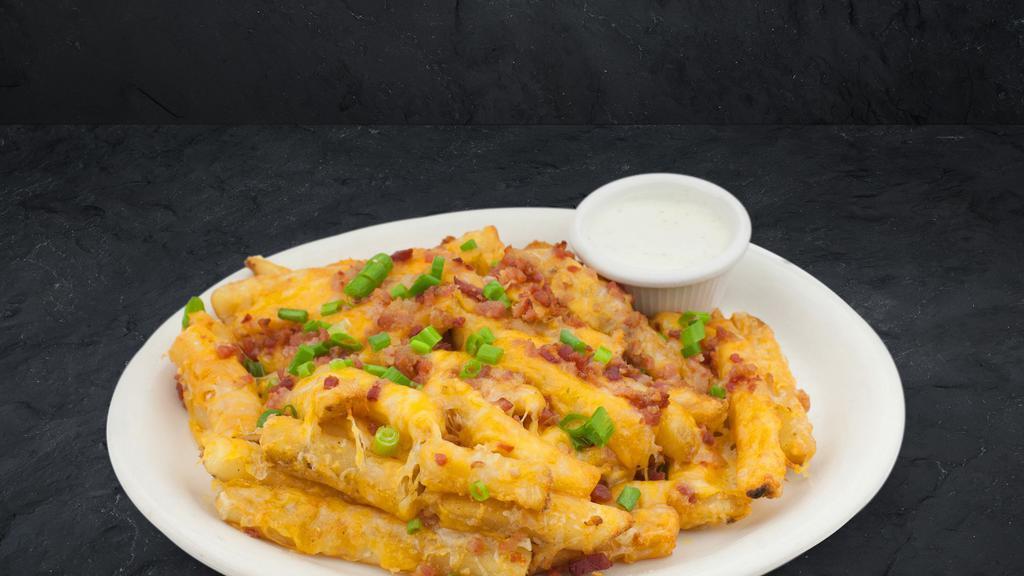 Cheese Fries · Our seasoned fries topped with cheese, bacon pieces, and green onion. Served with ranch sauce.