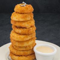 Tower Of Onion Rings · Lightly battered, giant onion rings fried golden brown and served with Cattleman's Petal Sau...