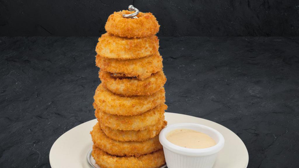 Tower Of Onion Rings · Lightly battered, giant onion rings fried golden brown and served with Cattleman's Petal Sauce.