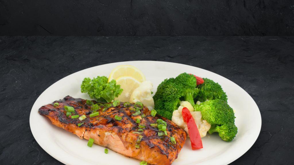 Grilled Salmon · Fresh Atlantic salmon, seasoned and grilled, then glazed with our sweet bourbon glaze and topped with chives.