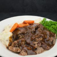 Pot Roast · Slow cooked tender chuck roast garnished with carrots.