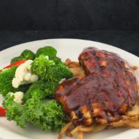 Bbq Chicken Breast · Grilled boneless breast of all-natural chicken with a sweet BBQ sauce on a bed of tobacco on...