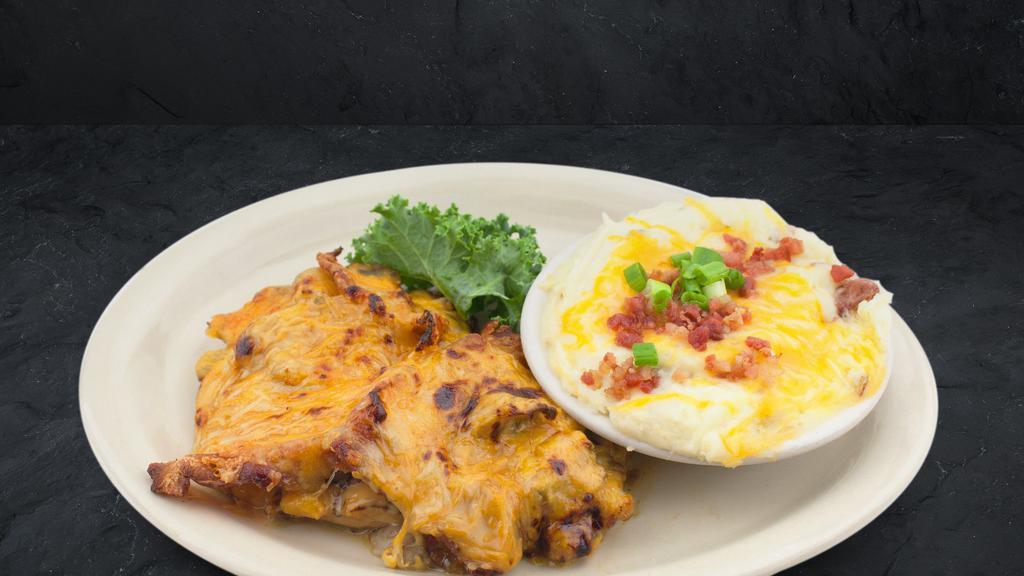 Smothered Grilled Chicken · Grilled boneless breast of all-natural chicken, smothered with honey Dijon, mushrooms, bacon, Monterey jack and cheddar cheese.