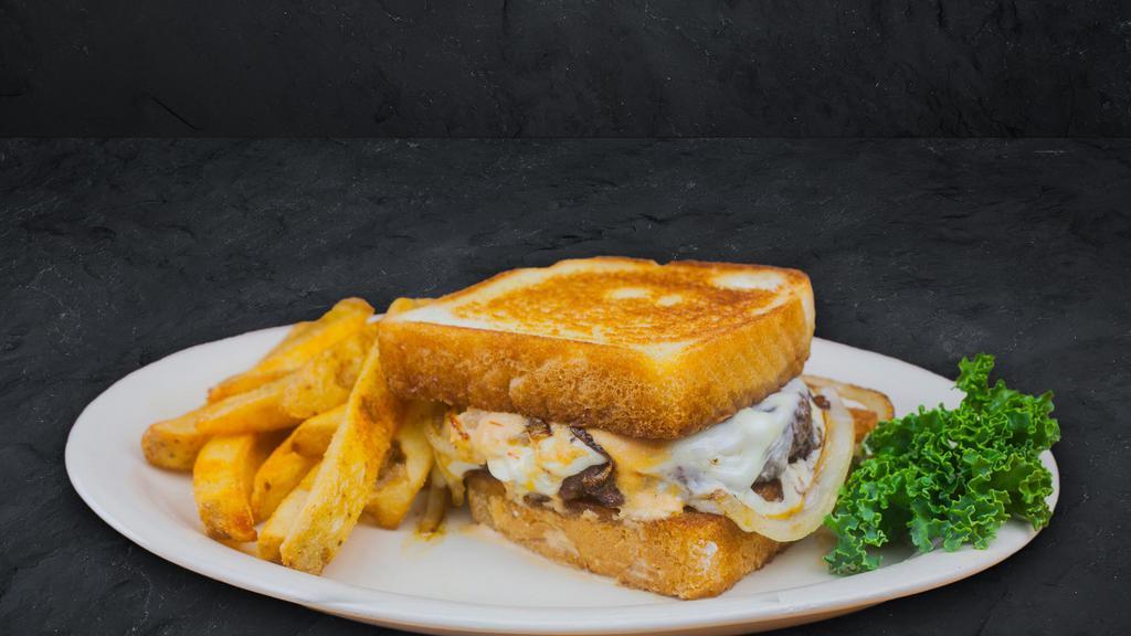Patty Melt · Fresh ground Angus beef topped off with Swiss cheese, caramelized onions, and Cattleman's Petal Sauce all on Texas toast.