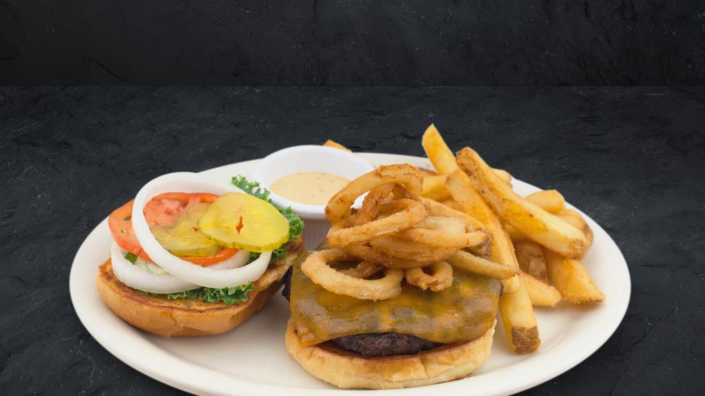 Cattleman'S Tobacco Burger · Half pound Cattleman’s Gold Certified burger topped with cheddar cheese, tobacco onions and Cattleman’s Petal Sauce.
