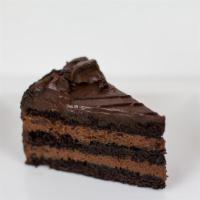Chocolate Layer Mousse Cake · A true delight for all chocolate lovers! Three delicious layers of moist chocolate cake sepa...
