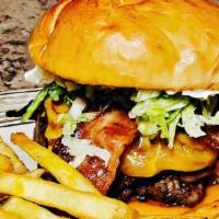 1/4 Lb Burger · Delicious burger topped with lettuce, tomatoes, and onions on brioche bun with or without ch...