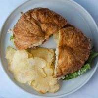 Tarragon Chicken Salad Sandwich · Our famous Taragon Chicken Salad, lettuce, tomato, mayo served on a buttery croissant. Comes...