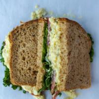 Egg Salad Sandwich · House made egg salad, lettuce, tomato, mayo served on wheat bread.  Comes with chips or baby...