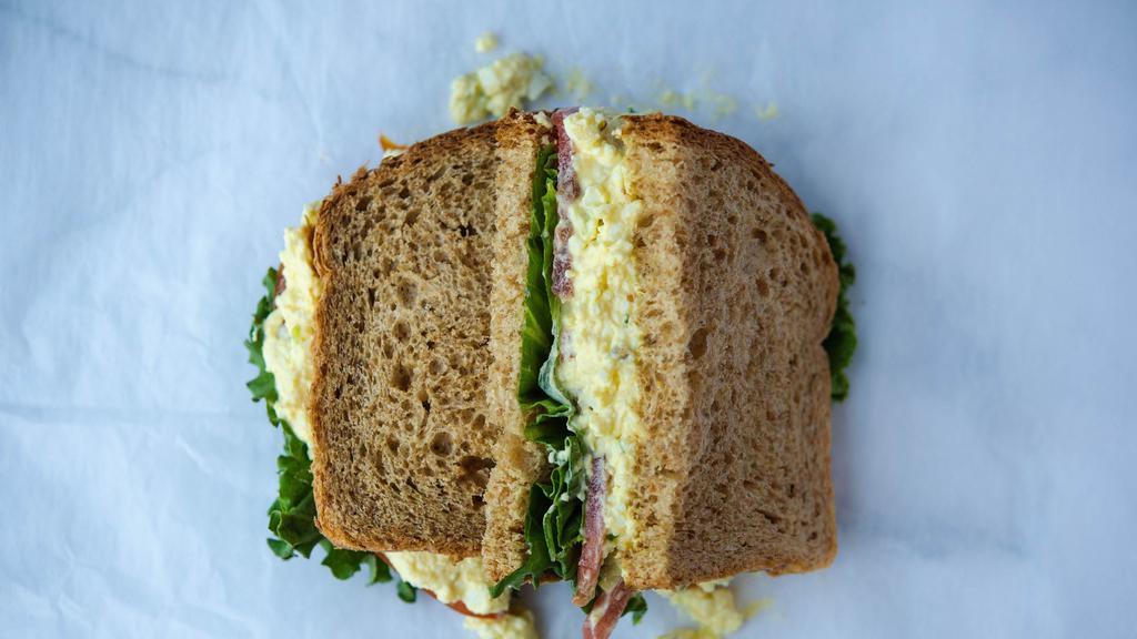 Egg Salad Sandwich · House made egg salad, lettuce, tomato, mayo served on wheat bread.  Comes with chips or baby carrots