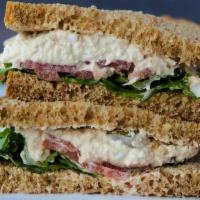 Tuna Salad Sandwich · House made Tuna Salad, lettuce, tomato, mayo served on house made wheat bread.  Comes with c...