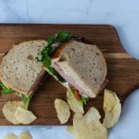 Smoked Ham Sandwich · Smoked ham, lettuce, tomato, mayo served on german sourdough bread.  Comes with chips or bab...