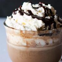 Mocha · Espresso + chocolate + steamed milk + whipped cream + chocolate drizzle