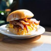 Breakfast Sandwich · Cage free scrambled eggs, cheddar, choice of protein, drizzled with honey sriracha glaze on ...