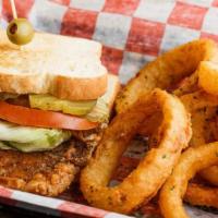 Porkchop Sandwich · Dressed with lettuce, tomatoes, and pickles. served on white bread with your choice of sides.