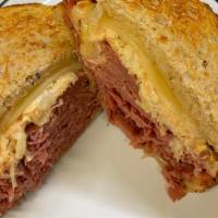 Reuben · Thinly sliced corned beef on jewish rye with our homemade thousand island dressing, sauerkra...