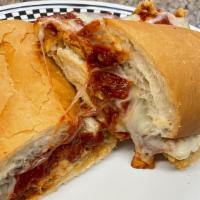 Chicken Parmesan Po-Boy · Two chicken breasts smothered in red gravy, melted mozzarella cheese & parmesan cheese.