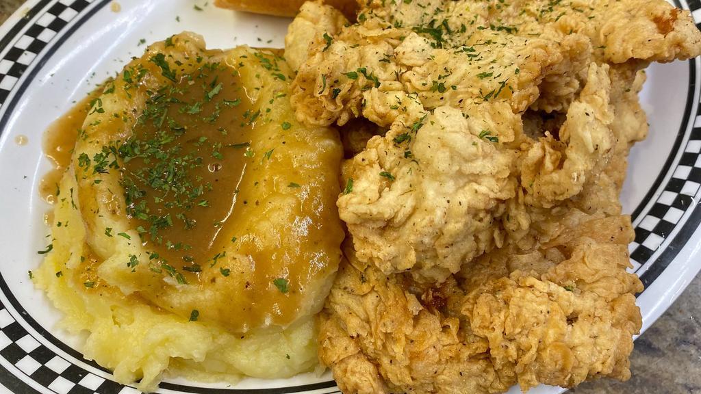 Fried Boneless Chicken Breast & Mashed Potatoes · served with daily vegetable & garlic bread