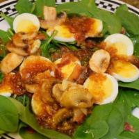 Spinach Salad · baby spinach, boiled egg, bacon, mushrooms & served with our homemade spinach salad dressing