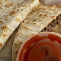 Cheesesteak Quesadillas (New) · A garlic herb tortilla filled with shredded angus beef or chicken, bell peppers, onions, mus...