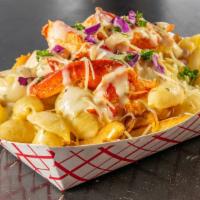 Lobster Mac And Cheese Fries · Lobster | Conchiglie pasta | Boursin cheese sauce | Asiago cheese | Parsley