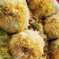 Dahi Sev Puri · Fried Flour Crisps Filled With Potatoes, Spilled Beans Spicy Sauces & Yogurt Topped With Flo...