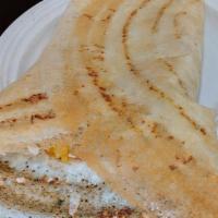 Rava Plain Dosa · A Thin And Crispy Crepe Made From Rava Filling With an Onion Filling.