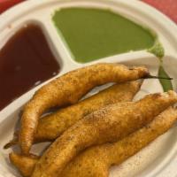 Spicy Mirch Bhuji (4 Pcs) · Green chilies dipped in chickpea flour and deep fried.