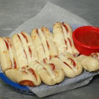Stuffy Stix · Bread sticks stuffed with mozzarella, garlic butter, and two of your favorite toppings.