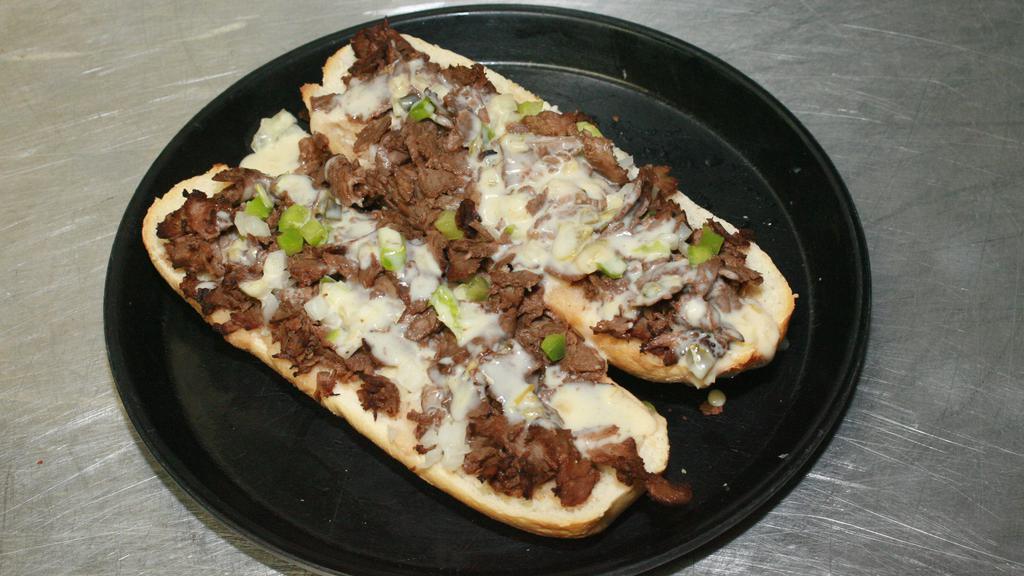 S. Pizza’S Philly Cheesesteak · Roasted beef or fajita chicken topped with green bell peppers and onions, baked on a sourdough hoagie and layered with our award-winning cheese dip.