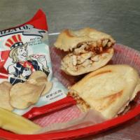 Bbq Chicken · Fajita chicken in a tangy BBQ sauce, topped with white cheddar on a sourdough bun.