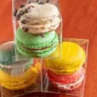 Macarons · Seasonal flavors. This month is strawberry and white chocolate drizzle. Our colorful cookie ...