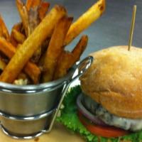 Pork Chop Sandwich & Fries · Thick cut of meat from a pig typically cut from the spine.