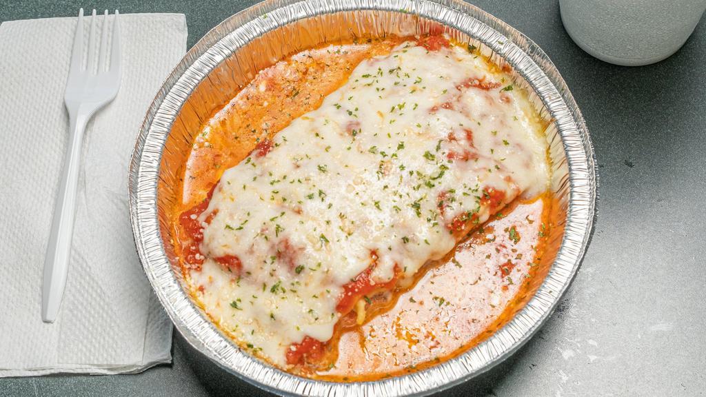 Lasagna · Ground beef, mozzarella and ricotta cheese with our special sauce on the side. Served with a side salad and garlic breadstick.