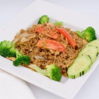 Thai Fried Rice · Stir-fried rice with egg, broccoli, onion, green onion topped with sliced cucumber and tomato.