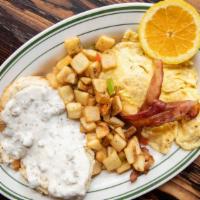 Biscuits & Gravy · Buttermilk biscuits smothered in our sausage country gravy served with two eggs and choice o...