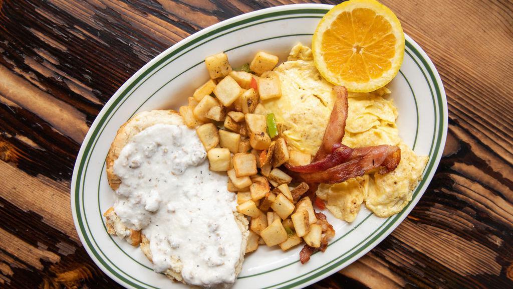 Biscuits & Gravy · Buttermilk biscuits smothered in our sausage country gravy served with two eggs and choice of bacon, sausage, and a choice of grits, hash browns or fruit.