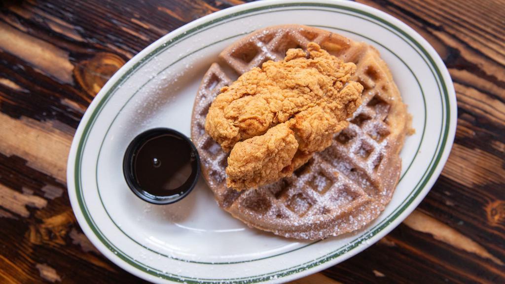 Chicken & Waffles · Crispy Southern fried chicken breast served on top of a Belgian waffle with a honey Tabasco glaze