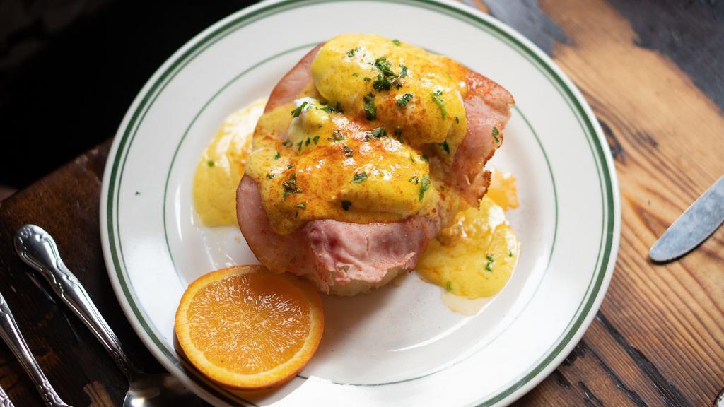 Eggs Benedict · Two poached eggs served with country ham atop French bread with hollandaise