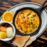 Andouille & Eggs · Two baked eggs on top of andouille sausage, green onion and fresh tomato covered with Chedda...