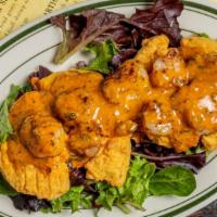 Fried Green Tomatoes With Gulf Shrimp Remoulade · Crispy fried green tomatoes topped with seasoned, grilled Gulf shrimp and Louisiana remoulad...