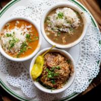 Crescent City Sampler · Sampling of the city's best dishes: cajun jambalaya, crawfish etouffée and chicken & andouil...