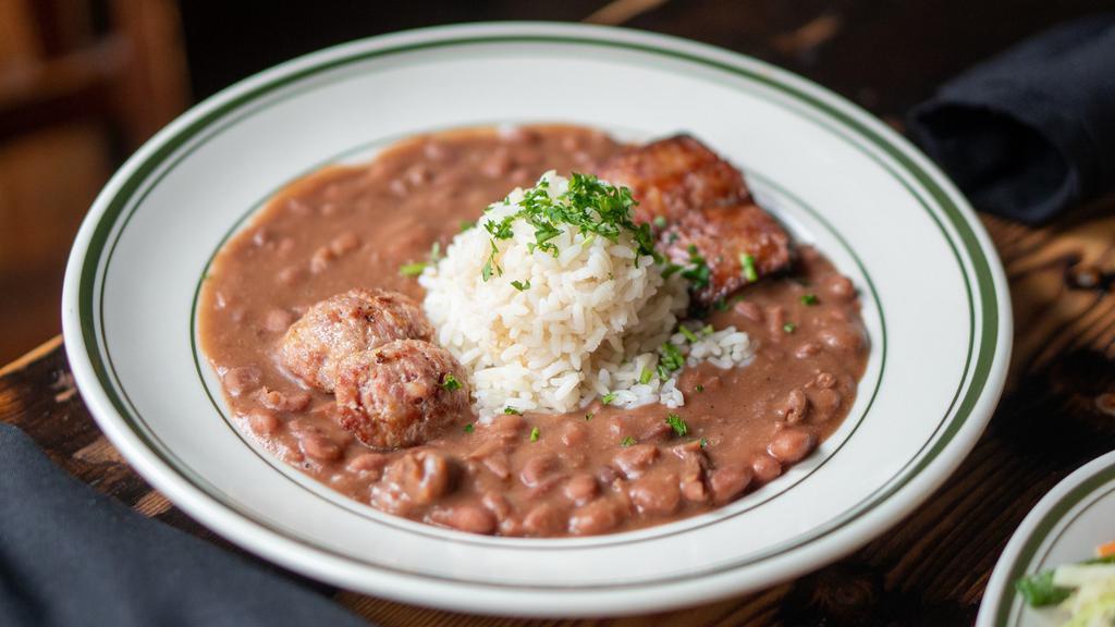 Red Beans & Rice · Creamy, slow-cooked red beans served with white rice, topped with andouille and alligator sausage.